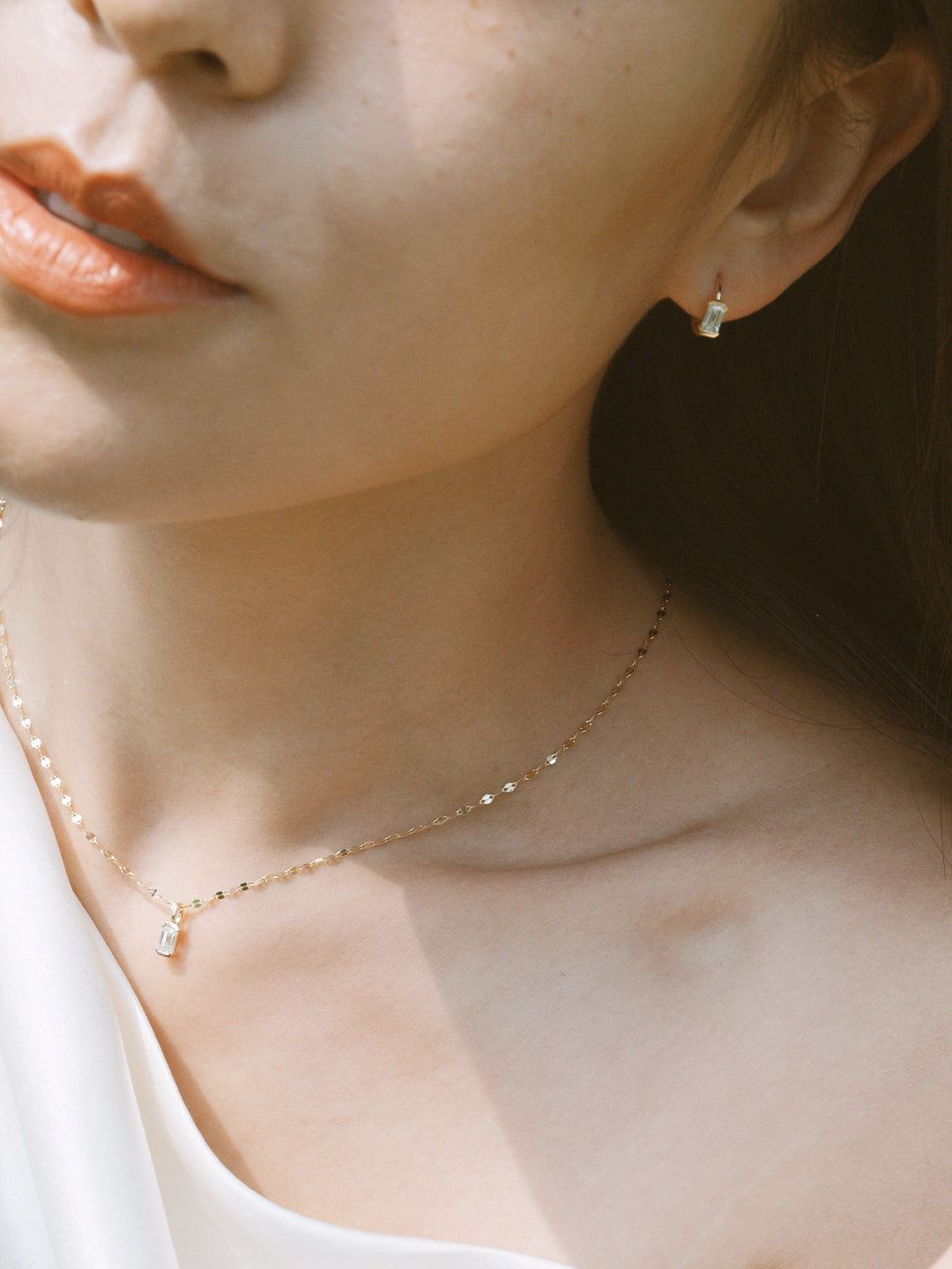 The Radiance Emerald Diamond Huggie Hoops