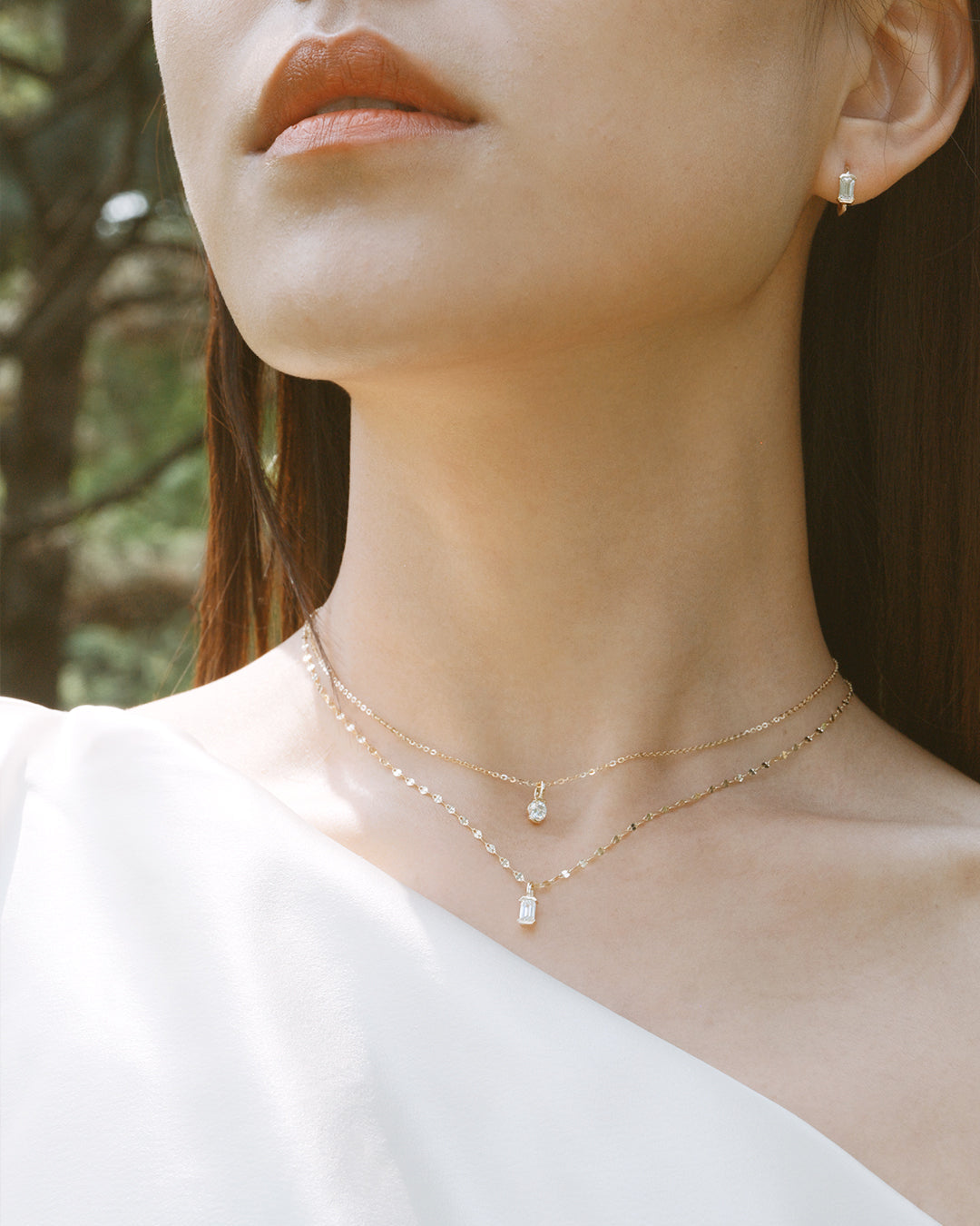 The Radiance Emerald Diamond Huggie Hoops