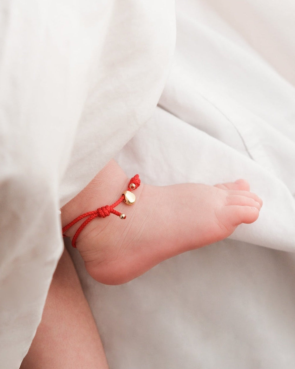 The Seed Adjustable Red Cord Baby Bracelet 2