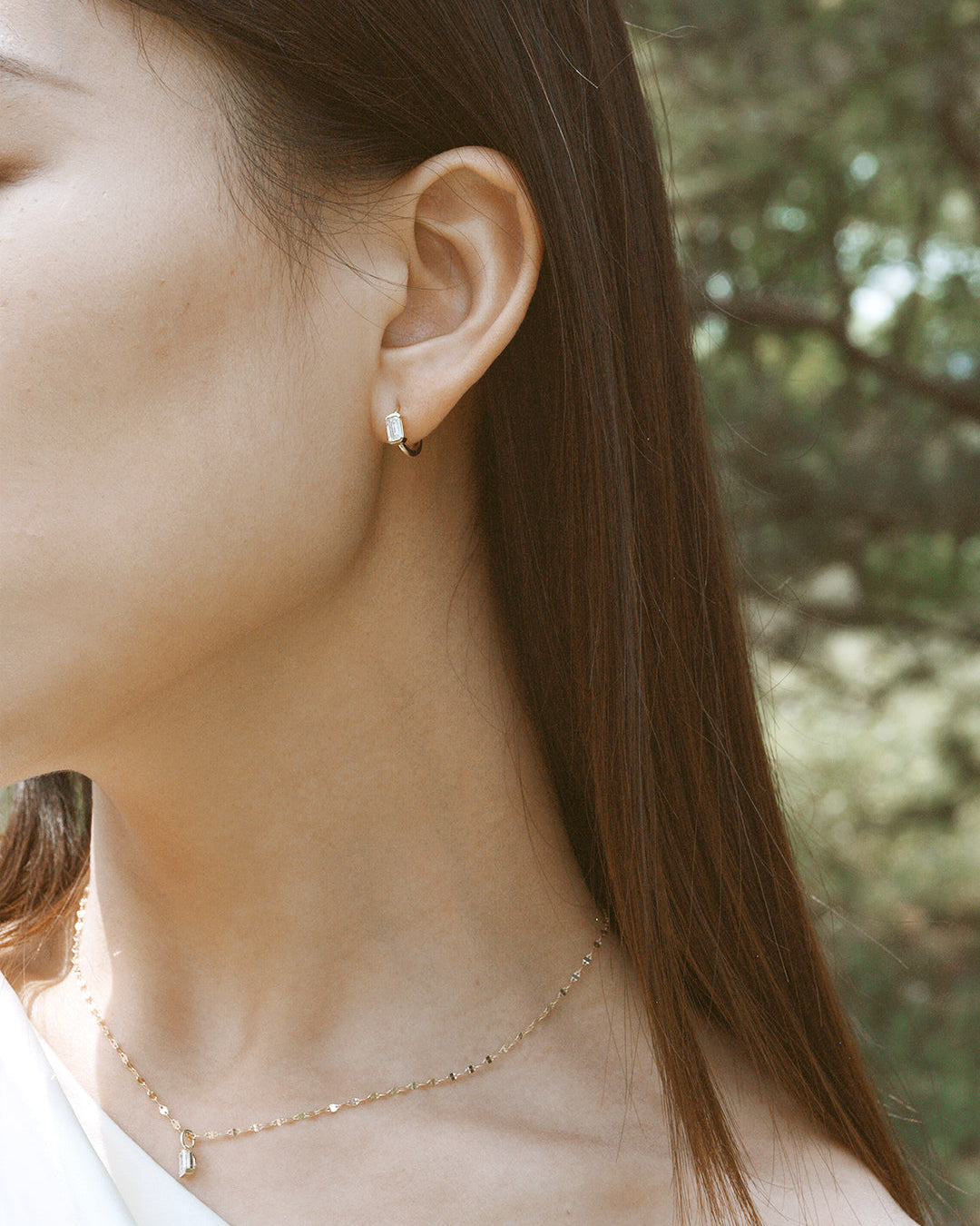 The Radiance Emerald Diamond Huggie Hoops